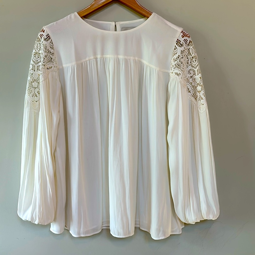White flowy top with crochet shoulders from Loft size M